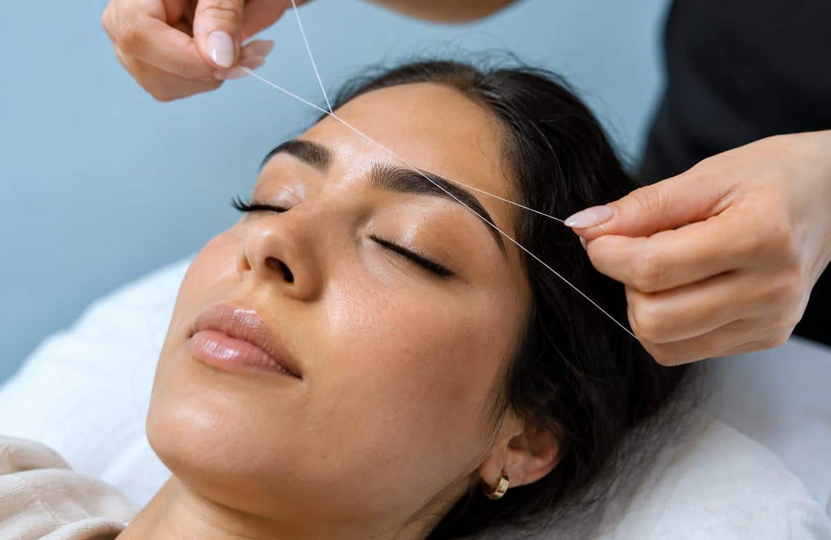 eyebrow threading relaxing client