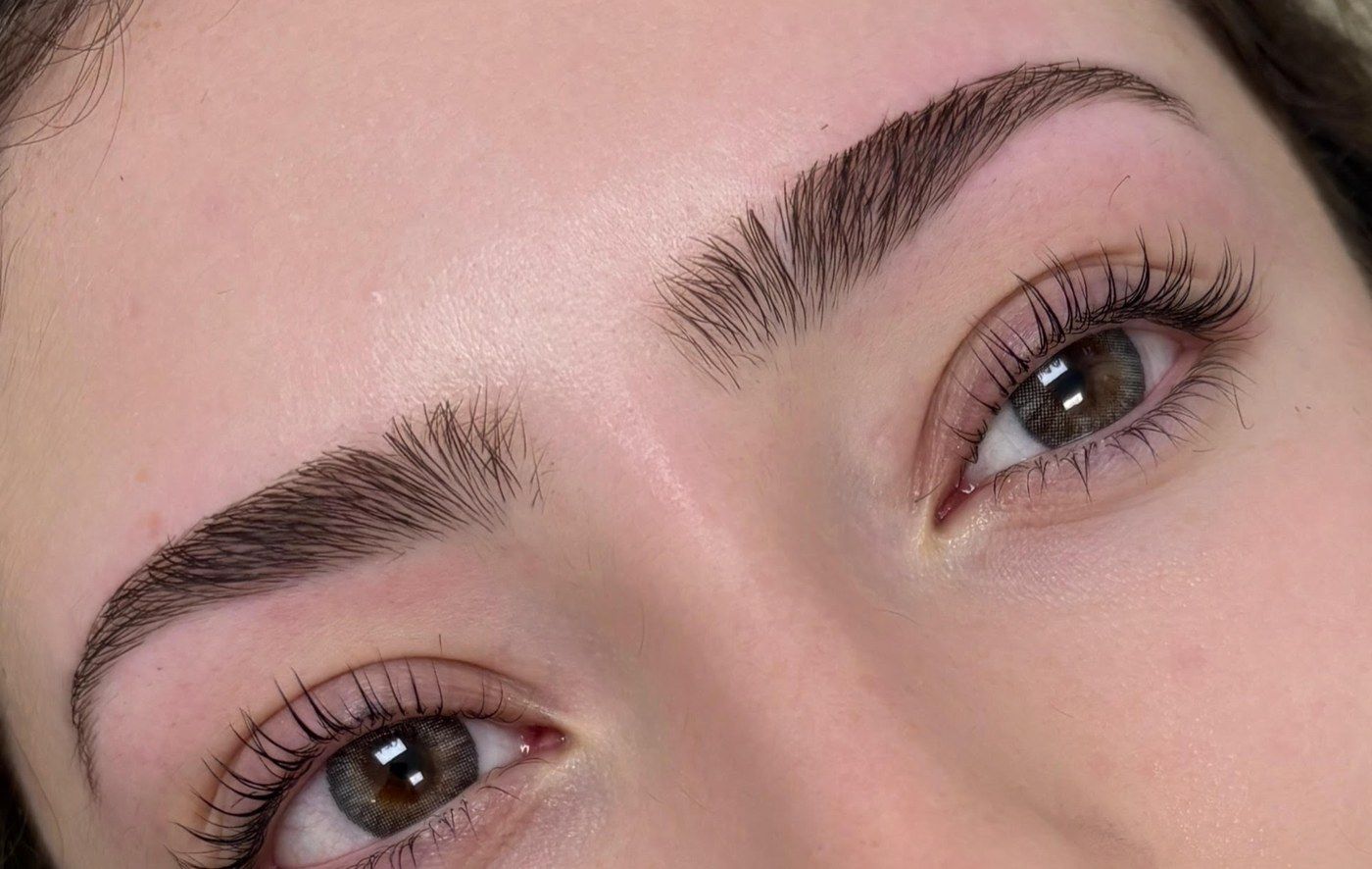 Lifted, tinted natural lashes and brushed-up brows after a lash lift at The Brow Fixx