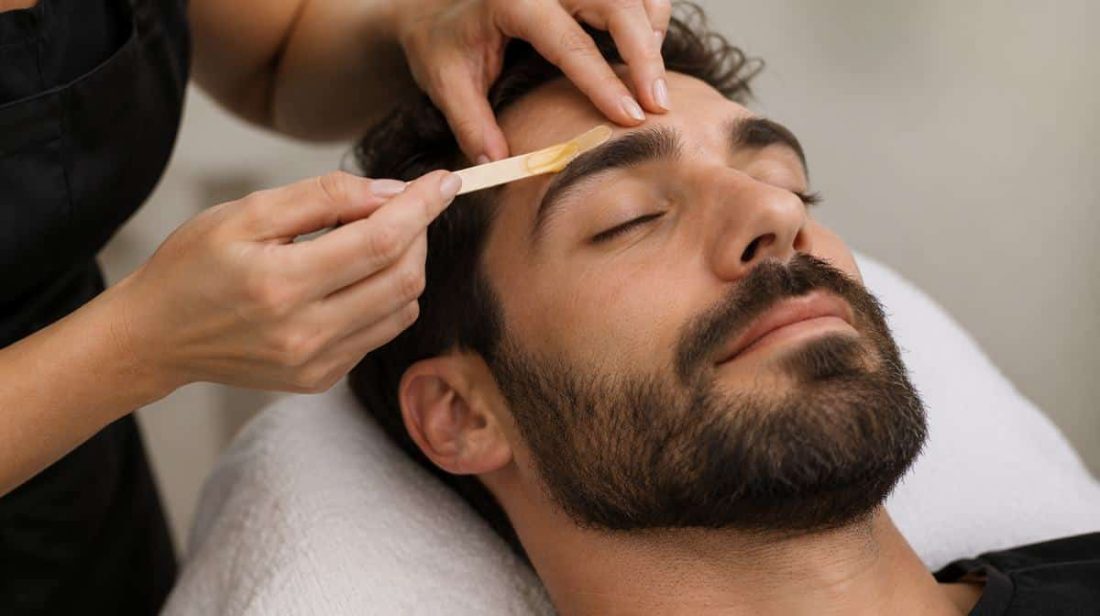 Man getting his brows waxed